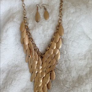 Gold toned statement necklace and earring set